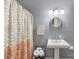 Bathroom with pedestal sink, shower, and decorative shower curtain at 118 Broadbill Dr, Mooresville, NC 28117
