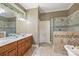 Large bathroom with double vanity and walk-in shower at 118 Broadbill Dr, Mooresville, NC 28117