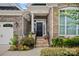 Inviting front entrance with stone accents and landscaping at 16015 Vale Ridge Dr # 133, Charlotte, NC 28278