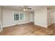 Living room with hardwood floors and ceiling fan at 1532 Downs Ave, Charlotte, NC 28205