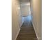 Hallway with wood-look flooring and white doors at 1225 Dodd St, Shelby, NC 28152