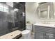 Elegant bathroom featuring a walk-in shower, gray tile, and modern vanity at 514 Billy Howey Rd, Waxhaw, NC 28173