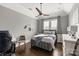 Modern bedroom with a queen bed, hardwood floors, and soccer theme at 514 Billy Howey Rd, Waxhaw, NC 28173