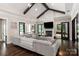 Relaxing living room with hardwood floors, a fireplace, and access to the backyard at 514 Billy Howey Rd, Waxhaw, NC 28173