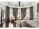 Bright main bedroom featuring hardwood floors and a sitting area with large windows at 514 Billy Howey Rd, Waxhaw, NC 28173