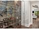 Impressive wine cellar with glass-front storage, brick accent wall, and ample wine bottle space at 514 Billy Howey Rd, Waxhaw, NC 28173