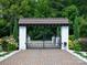 Ornate entrance gate with brick driveway at 514 Billy Howey Rd, Waxhaw, NC 28173