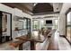 Outdoor kitchen and dining area with long wooden table and stainless steel appliances at 514 Billy Howey Rd, Waxhaw, NC 28173