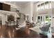 Open living space showcasing a curved staircase, a wet bar, and views of the pool at 514 Billy Howey Rd, Waxhaw, NC 28173