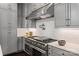 Modern kitchen with stainless steel appliances and white quartz countertops at 514 Billy Howey Rd, Waxhaw, NC 28173