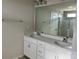 Double vanity bathroom with white cabinets and quartz countertops at 1483 Honey Trl, Monroe, NC 28112