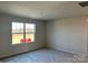 Spacious bedroom with large window and new carpet at 1483 Honey Trl, Monroe, NC 28112