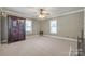 Large living room with neutral carpeting and a ceiling fan at 300 Congress N St, York, SC 29745