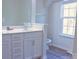 Bathroom with double vanity, a toilet and a window at 10334 Gold Pan Rd, Charlotte, NC 28215