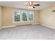 Bright bedroom featuring neutral walls, carpeting, and three windows at 205 Martin Luther King Jr Ave, Salisbury, NC 28144
