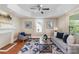 Bright living room featuring hardwood floors, a cozy seating area, and decorative artwork at 205 Martin Luther King Jr Ave, Salisbury, NC 28144