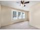 Spacious bedroom with neutral carpeting and ceiling fan at 205 Martin Luther King Jr Ave, Salisbury, NC 28144