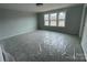 Bedroom with two windows overlooking trees and fields at 4808 Glen Stripe Dr # Cal0036, Indian Trail, NC 28079