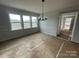 Dining room with chandelier, chair rail molding, and windows at 4808 Glen Stripe Dr # Cal0036, Indian Trail, NC 28079