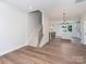 Open concept dining area with kitchen view and hardwood floors at 8009 Elevate Ct, Charlotte, NC 28205