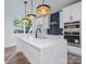 Modern kitchen with white cabinets, quartz countertops, and island at 8009 Elevate Ct, Charlotte, NC 28205
