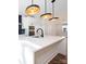 Modern kitchen with white cabinets, quartz countertops, and island at 8009 Elevate Ct, Charlotte, NC 28205