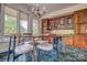 Breakfast nook features wood cabinetry and a glass-top table at 8 Blackberry Ln, Lake Wylie, SC 29710