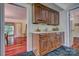 Wet bar with wood cabinets and a granite countertop at 8 Blackberry Ln, Lake Wylie, SC 29710