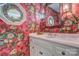 Charming powder room with floral wallpaper and marble vanity at 8 Blackberry Ln, Lake Wylie, SC 29710