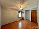 Spacious bedroom with hardwood floors and double doors at 2232 Stallings Rd, Matthews, NC 28104