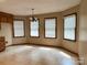 Bright dining area with tile floors and three windows at 2232 Stallings Rd, Matthews, NC 28104