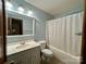 Clean bathroom with tub shower, and vanity at 2232 Stallings Rd, Matthews, NC 28104