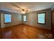 Bright bedroom with hardwood floors and ceiling fan at 2232 Stallings Rd, Matthews, NC 28104