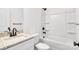 Bathroom with granite countertop, white cabinets, and bathtub at 1332 Caldwell St, Statesville, NC 28677