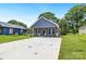 Newly built home with a concrete driveway and well-maintained lawn at 1332 Caldwell St, Statesville, NC 28677