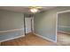 Bright bedroom with wood floors and mirrored closet at 171 Timberbrook Ln # 16, Statesville, NC 28625