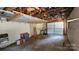 Unfinished garage with overhead storage and ample space at 171 Timberbrook Ln # 16, Statesville, NC 28625