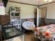 Bedroom with bookcase, comfy chair, and large window at 960 E 1St St, Newton, NC 28658