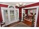 Entryway with hardwood floors, chandelier, and view to dining room at 522 Maupin Ave, Salisbury, NC 28144