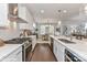 Modern kitchen with white cabinets and island at 136 Wesser St # 53, Davidson, NC 28036