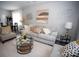 Living room with gray sofa, decorative pillows, and a coffee table at 195 Edward Ave # 13, Concord, NC 28025