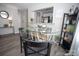 Dining area with round glass table and black chairs near a bookshelf at 195 Edward Ave # 13, Concord, NC 28025