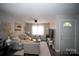 Bright living room featuring comfortable seating, a large TV, and stylish decor at 195 Edward Ave # 13, Concord, NC 28025