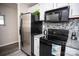Modern kitchen features stainless steel appliances and granite countertops at 195 Edward Ave # 13, Concord, NC 28025