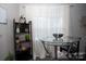 Bright dining area with round glass table and black chairs at 195 Edward Ave # 13, Concord, NC 28025