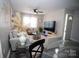 Living room with gray sectional sofa and stylish decor at 195 Edward Ave # 13, Concord, NC 28025