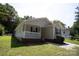 Tan house with a brick base, porch, and landscaping at 195 Edward Ave # 13, Concord, NC 28025