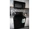 Black stove and microwave in modern kitchen at 195 Edward Ave # 13, Concord, NC 28025