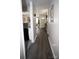 Bright entryway with dark wood-look floors and view into living area at 195 Edward Ave # 13, Concord, NC 28025