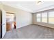 Bedroom with carpet flooring and view of kitchen at 7025 Stella Pl, Stanley, NC 28164